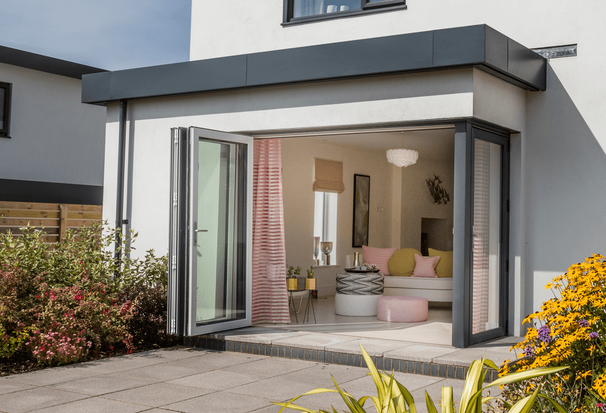 aluminium bi-folding doors looking into a homely living space